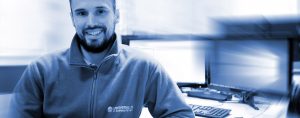 data recovery specialist sitting by pc